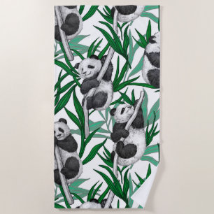 Panda cubs on beach towel
