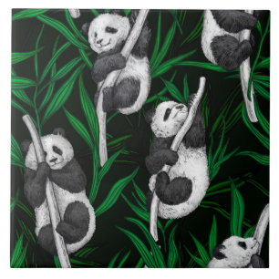 Panda cubs on dark green tile