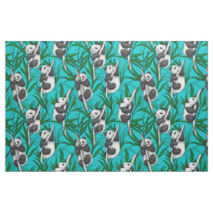 Panda cubs on turquoise fabric