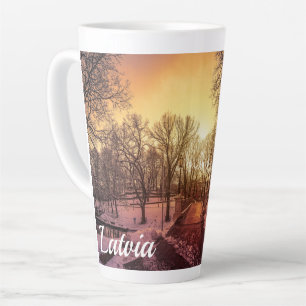 Panoramic view of snowy park during sunset in Riga Latte Mug