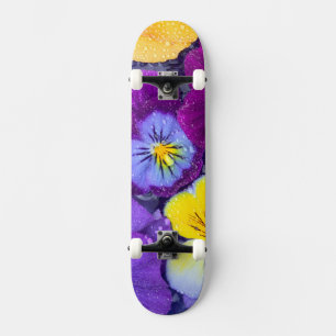 Pansy flowers floating in bird bath with dew 2 skateboard