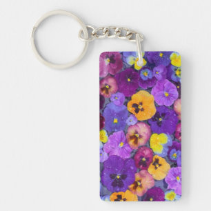 Pansy flowers floating in bird bath with dew keychain