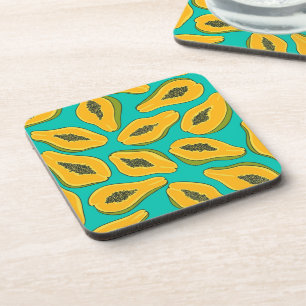 Papaya slices on turquoise coaster