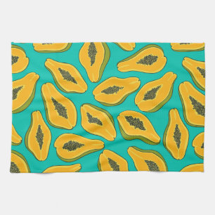 Papaya slices on turquoise kitchen towel