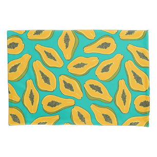 Papaya slices on turquoise pillowcase