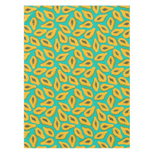 Papaya slices on turquoise tablecloth