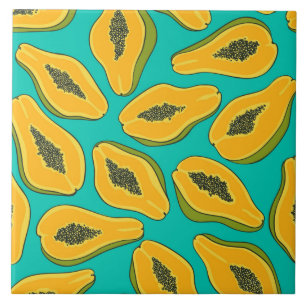 Papaya slices on turquoise tile