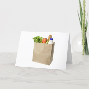 Paper bag full of groceries card