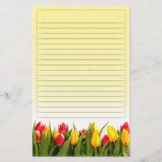 Papeterie La tulipe jaune rouge fleurit l'arrière - plan