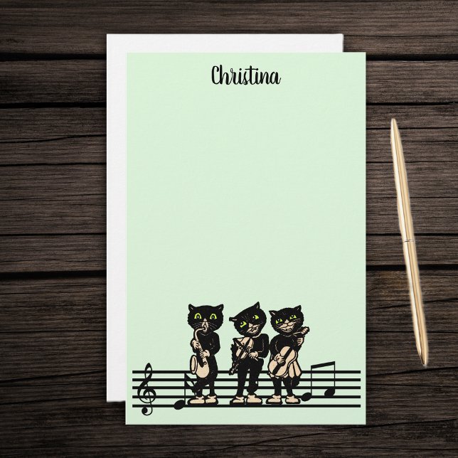 Papeterie Trois musiciens de chats noirs Instruments de musi (Three black cat musicians playing instruments on bar of music notes on green stationery paper pad.)