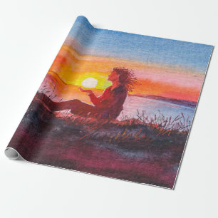 Papier Cadeau Beautiful ocean sunset. Portrait of young woman as