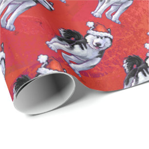 Papier Cadeau Chien de traîneau dans le casquette de Père Noë