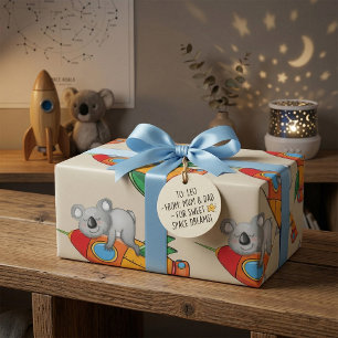 Papier Cadeau Koala endormi sur une fusée colorée 