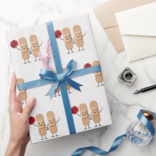 Papier Cadeau Pansements Complices de Cheerleading sur Fond Blan