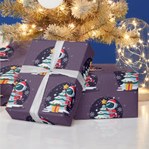 Papier Cadeau Petit astronaute décorant un sapin de Noël