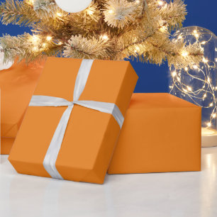 Papier Cadeau Vacances orange flèches blanches neige étoiles cad