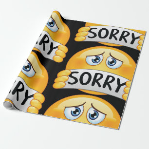 Papier Cadeau Visage d'émoji triste et désolé tenant un panneau 