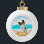 papillon Dog on Beach  Ceramic Ball Christmas Ornament<br><div class="desc">A papillon dog sitting on beach is a perfect gift idea for someone who love this dog breed.</div>