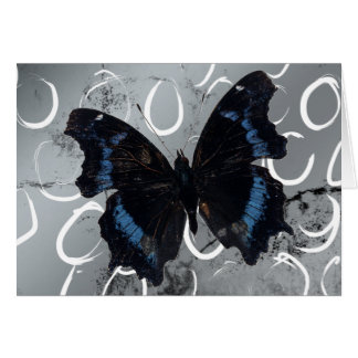 Papillon sur fond argenté avec cercles vides à l'i