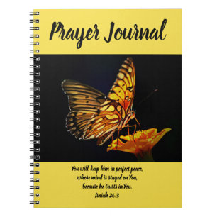 Papillon sur le journal de prière de souci