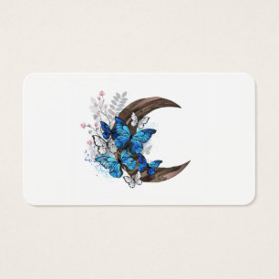 Papillons bleus sur croissant en bois