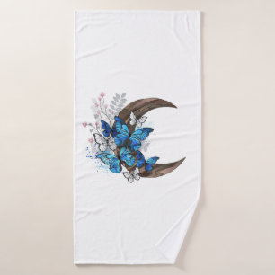 Papillons bleus sur croissant en bois