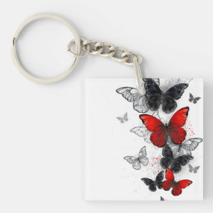 Papillons noirs et rouges volants