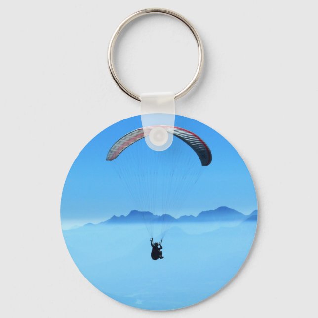 Paraglider on blue background with mountains keychain (Front)