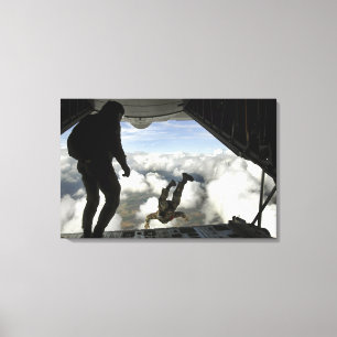 Pararescuemen jump out the back of a C-130 Canvas Print