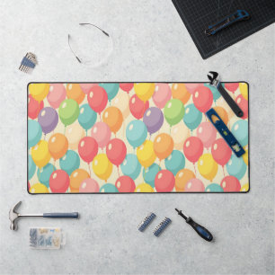 Party balloons in different colors desk mat