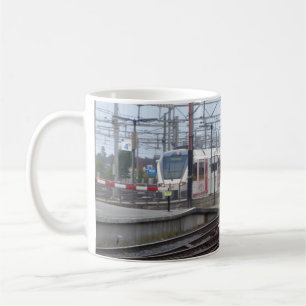 Passenger Trains arriving at station, mug