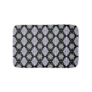 Pastel floral shapes on a black background bath mat
