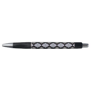 Pastel floral shapes on a black background pen