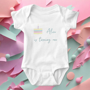 Pastel pink yellow cake is turning one  baby bodysuit
