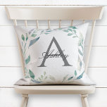Pastel Watercolor Wreath Name Initial Monogram Throw Pillow<br><div class="desc">Pastel Watercolor Wreath Name Initial Monogram Throw Pillow. This beautiful, elegant pillow features pastel a watercolor foliage wreath that frames the classic dark grey monogram initial, and the first name is written over the monogram initial in a beautiful calligraphy script. The design is the same on both the front and...</div>