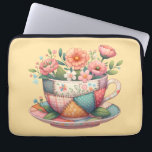 Patchwork Teacup with Whimsical Flowers Laptop Sleeve<br><div class="desc">A charming fusion of cozy cottagecore and nostalgic patchwork, this design features a teacup bursting with whimsical florals in soft, pastel hues. Each panel of the teacup is adorned with vintage-inspired fabric patterns—plaids, florals, and polka dots—stitched together with visible seams for a handmade, quilt-like look. The surrounding flowers bloom in...</div>