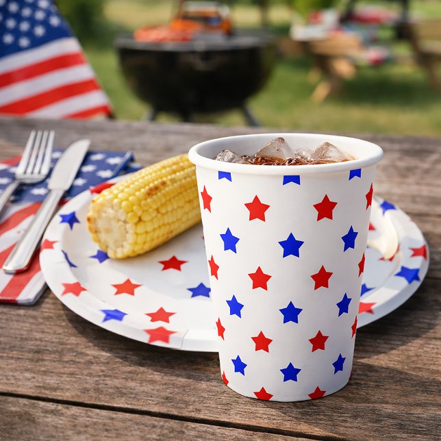 Patriotic Red and Blue Star Toss Pattern White Paper Cups (A paper cup with a red and blue star pattern on a white background.)