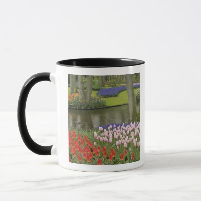 Pattern of tulips and grape hyacinth flowers, mug (Left)
