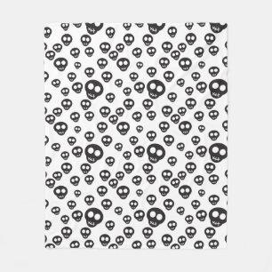 Pattern with black skulls on white fleece blanket