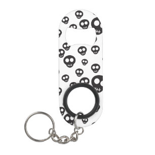 Pattern with black skulls on white keychain bottle opener