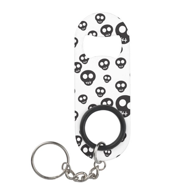 Pattern with black skulls on white keychain bottle opener (Front)