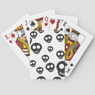 Pattern with black skulls on white playing cards