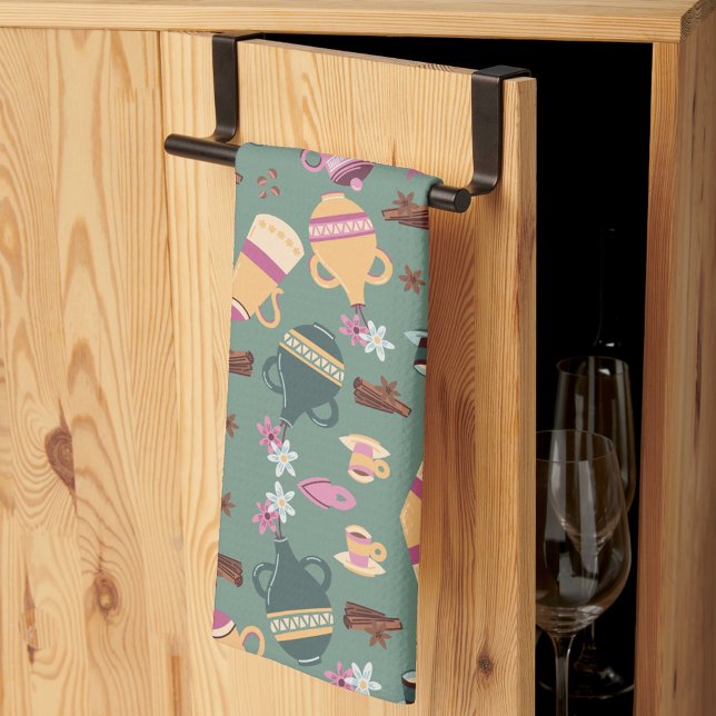 Patterned fabric featuring colorful teapots, cups, kitchen towel (Creator Uploaded)