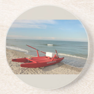 Pattino rosso sulla spiaggia - fotografia di mare coaster