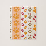 Paw Prints cute Dog Lovers Jigsaw Puzzle<br><div class="desc">Design with a cute pattern of dog paw prints in orange and yellow and warm colours. This design looks as though a dog has walked over the product ! For dog lovers everywhere.</div>