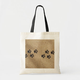 Paw prints in the sand bag
