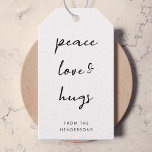 Peace Love and Hugs Minimal Simple White Christmas Gift Tags<br><div class="desc">Simple, stylish, minimalist holiday gift tags with modern informal casual handwritten script typography quote "Peace Love & Hugs" in black with a clean simple white background. The name can be easily customized for a personal touch. A elegant, minimalist and contemporary christmas design to stand out from the crowd this holiday...</div>