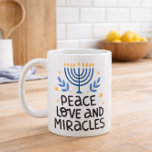 Peace love and miracles coffee mug<br><div class="desc">Give the gift of warmth and tradition this Hanukkah season. Our "Love, Light, and Miracles" coffee cups make thoughtful and meaningful presents for friends and family, allowing them to cherish the holiday spirit with each and every sip. Make your Hanukkah gatherings even more special with these beautifully designed coffee cups...</div>