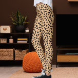 Peach And Dark Brown Safari Leopard Print Pattern Leggings<br><div class="desc">Turn heads in this peach and dark brown leopard print leggings. Vivid grey spots over a soft orange base create a modern safari statement perfect for yoga, gym workouts, running, or everyday streetwear. Buttery soft, stretchy, and flattering, it blends comfort with performance. Personalize by adding your own (optional) photo or...</div>