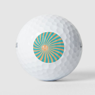 Peach and turquoise retro style sunburst design golf balls
